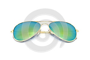 Gold sun glasses have a lens glass green yellow reflecting on an white background