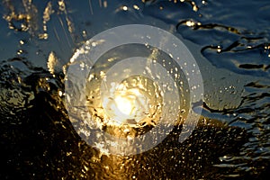 Gold Sunset abstract rain on the car front windshield