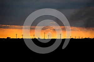 Gold sunset and electical wires big field minimalistic clouds smog urban space for text