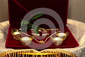 Gold Sycees or yuanbao gold ingot, symbol of wealth and prosperity, Gold Lace, Gold Necklace used as wedding dowry in photo