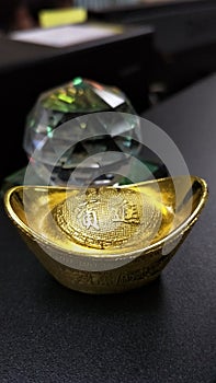 Gold Talisman and Reflection in the glass