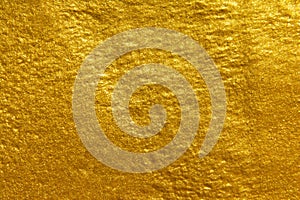 Gold texture background. Shiny rough gold texture surface