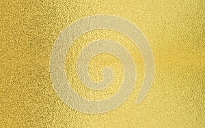 Gold texture background with yellow foil shiny shine glitter sparkle of light reflection on golden surface