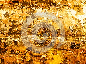 Gold textured background from scraps of foil