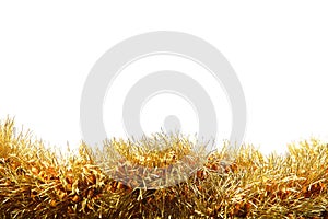 Gold tinsel on white background