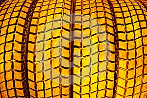 Gold tire tread close-up.The concept of expensive car maintenance.