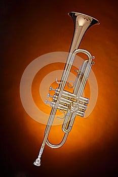Gold Trumpet Isolated on Spotlight