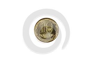 A gold Ukranian ten kopiyka coin on a white background
