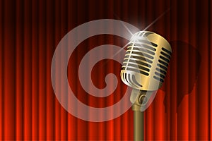 Gold vintage microphone illuminated and red curtain background. Retro music concept. Mic on empty theatre stage. Stand
