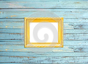 Gold Vintage picture frame on blue wood background