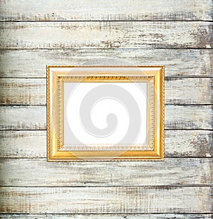 Gold Vintage picture frame on old wood background