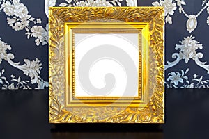 Gold Vintage picture frame on old wood background