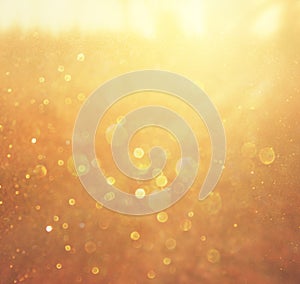 Gold and warm abstract bokeh lights. defocused background photo