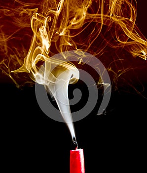 Gold and white smoke from an extinguished candle