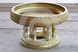 Gold wooden Ancient art traditional northern thai Chiang mai food tray called Khantoke on wooden table backgrounds
