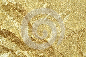 Gold wrinkled paper texture abstract background