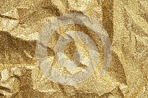 Gold wrinkled paper texture abstract background