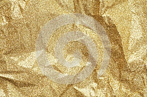 Gold wrinkled paper texture abstract background