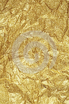 Gold wrinkled paper texture abstract background