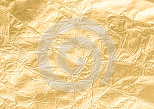 Gold wrinkled paper texture abstract background