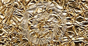 Gold wrinkled shiny textured metallic paper background, banner