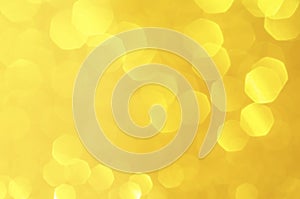 Gold,yellow abstract light background, Gold  bokeh shining lights, sparkling glittering Christmas lights.Season greeting backgroun