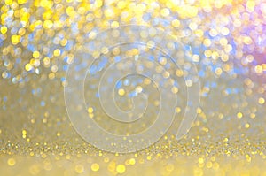 Gold, yellow,blue,pink abstract light background, Golden shining lights, sparkling glittering Christmas lights. Blurred abstract h