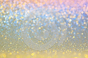 Gold, yellow,blue,pink abstract light background, Golden shining lights, sparkling glittering Christmas lights. Blurred abstract h