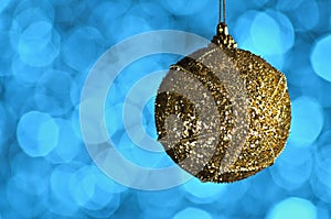 Gold,yellow New Year and Christmas ball on blue background with