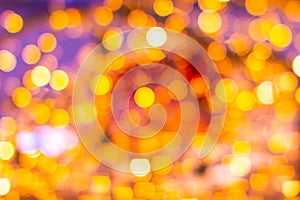 Gold yellow and red abstract background with bokeh defocused blurred lights