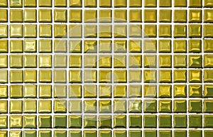 Gold yellow square mosaic tiles for ceramic wall and floor texture background in bathroom. Design golden pattern geometric with