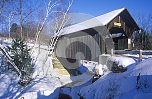 The Goldbrook Covered Bridge in Stowe, Vermont during the winter photo