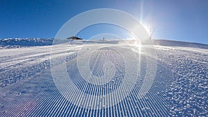 Goldeck - A skier going down the groomed slope