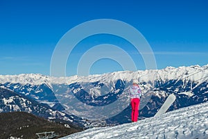 Goldeck - A Snowboarding girl enjoying the snowy Alps