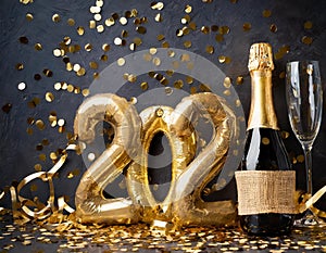 Golden 2024 new year numbers with confetti and champagne bottle