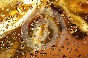 Golden abstract background with water drops