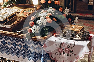 golden altar with bible crowns and cross in church before wedding ceremony