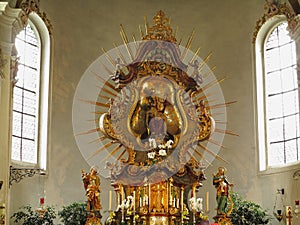 Golden altar with rays of pilgrimage church ornamental