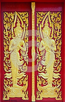 Golden angle sculpture at Thai temple door
