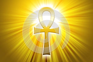 Golden Ankh with sunbeams photo