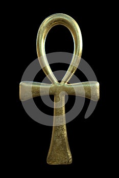 Golden ankh symbol on black background