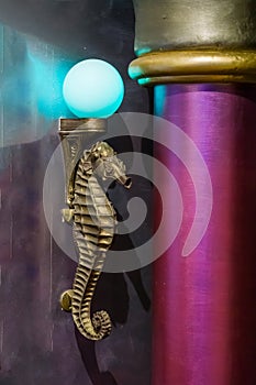 Golden antique seahorse marine life animal sculpture lamp with a blue light bulb