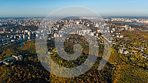 Golden autumn background, aerial drone view of forest with yellow trees and beautiful lake landscape from above, Kiev, Ukraine