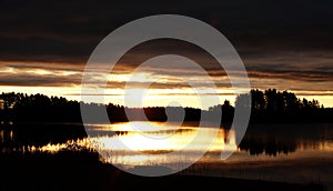 Golden autumn sunrise at lake Ã–je in Dalarna in Sweden