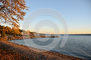 Golden Autumn sunset on Cayuga Lake shoreline