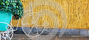 golden background with garden decoration with old bicycle