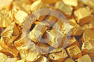 Golden Background. Ingots or Nuggets of Pure Gold. Gold leaf. Te