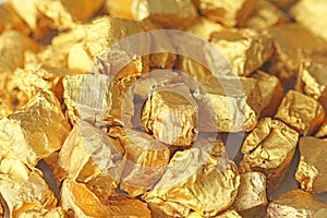 Golden Background. Ingots or Nuggets of Pure Gold. Gold leaf. Te