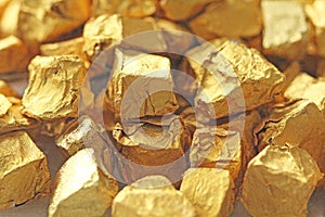 Golden Background. Ingots or Nuggets of Pure Gold. Gold leaf. Te