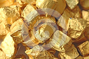 Golden Background. Ingots or Nuggets of Pure Gold. Gold leaf. Te